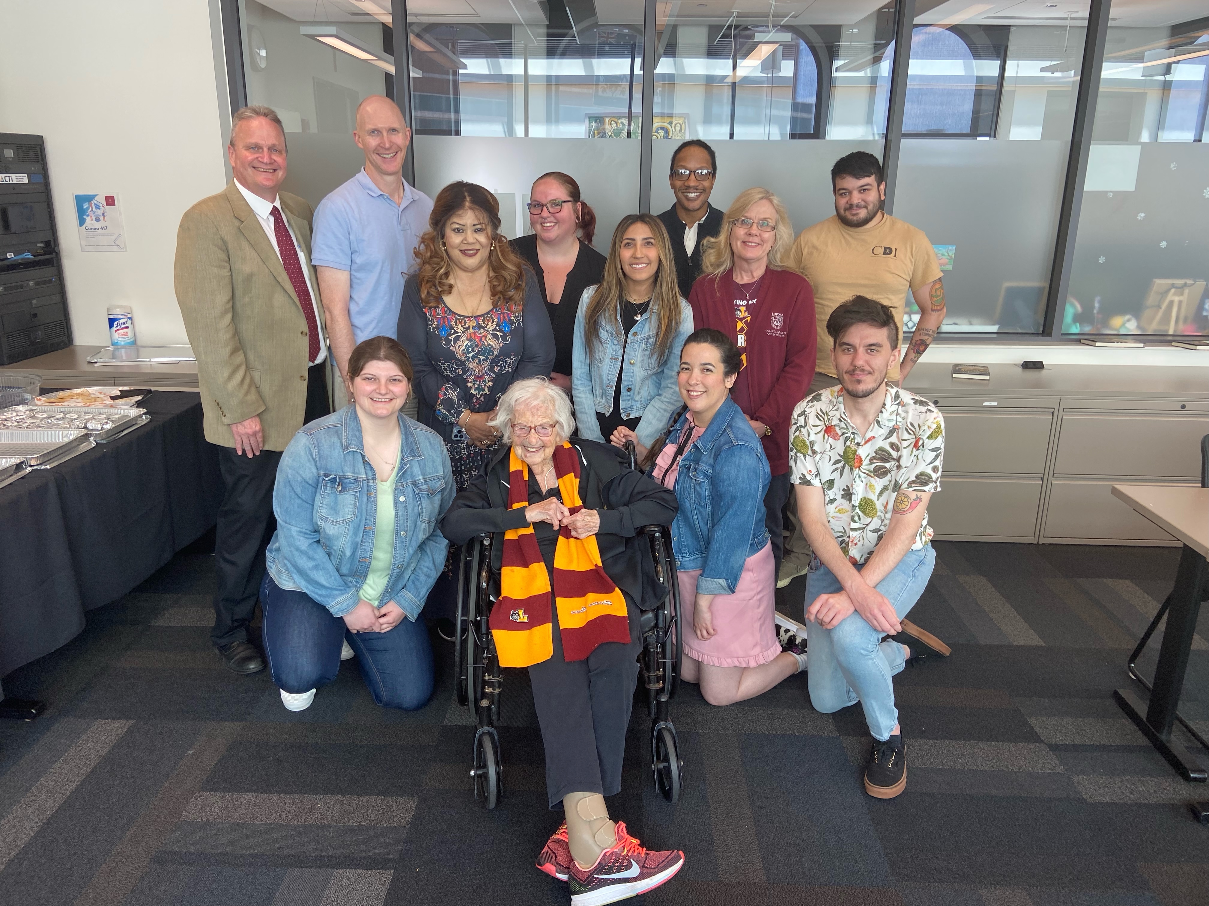 2024 CAS Advisors standing with Sister Jean and Dean Schraeder.